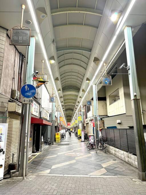 Appartement 105号室花園駅2分ツインベットルームミニキッチンと専用バスルーム付き Ōsaka